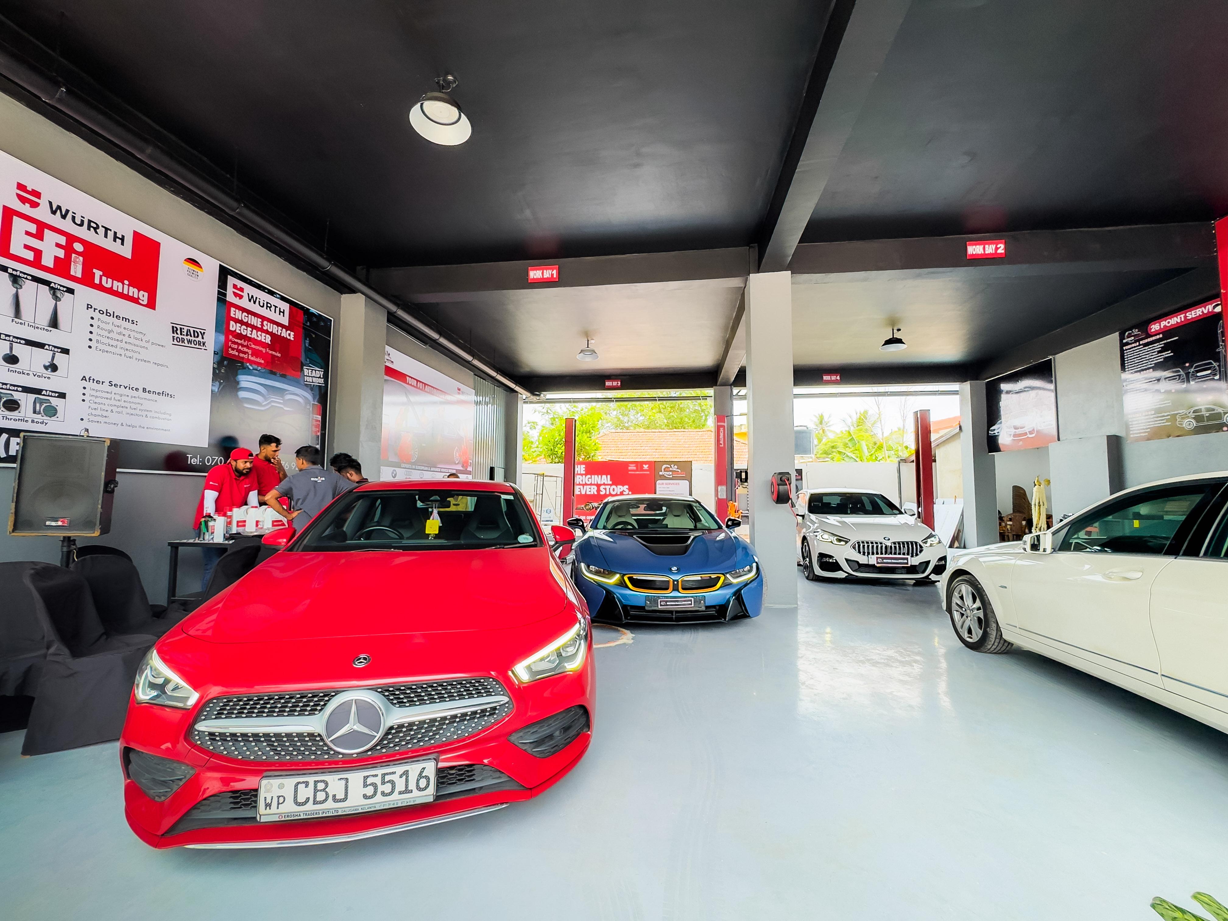 Workshop interior with multiple premium cars