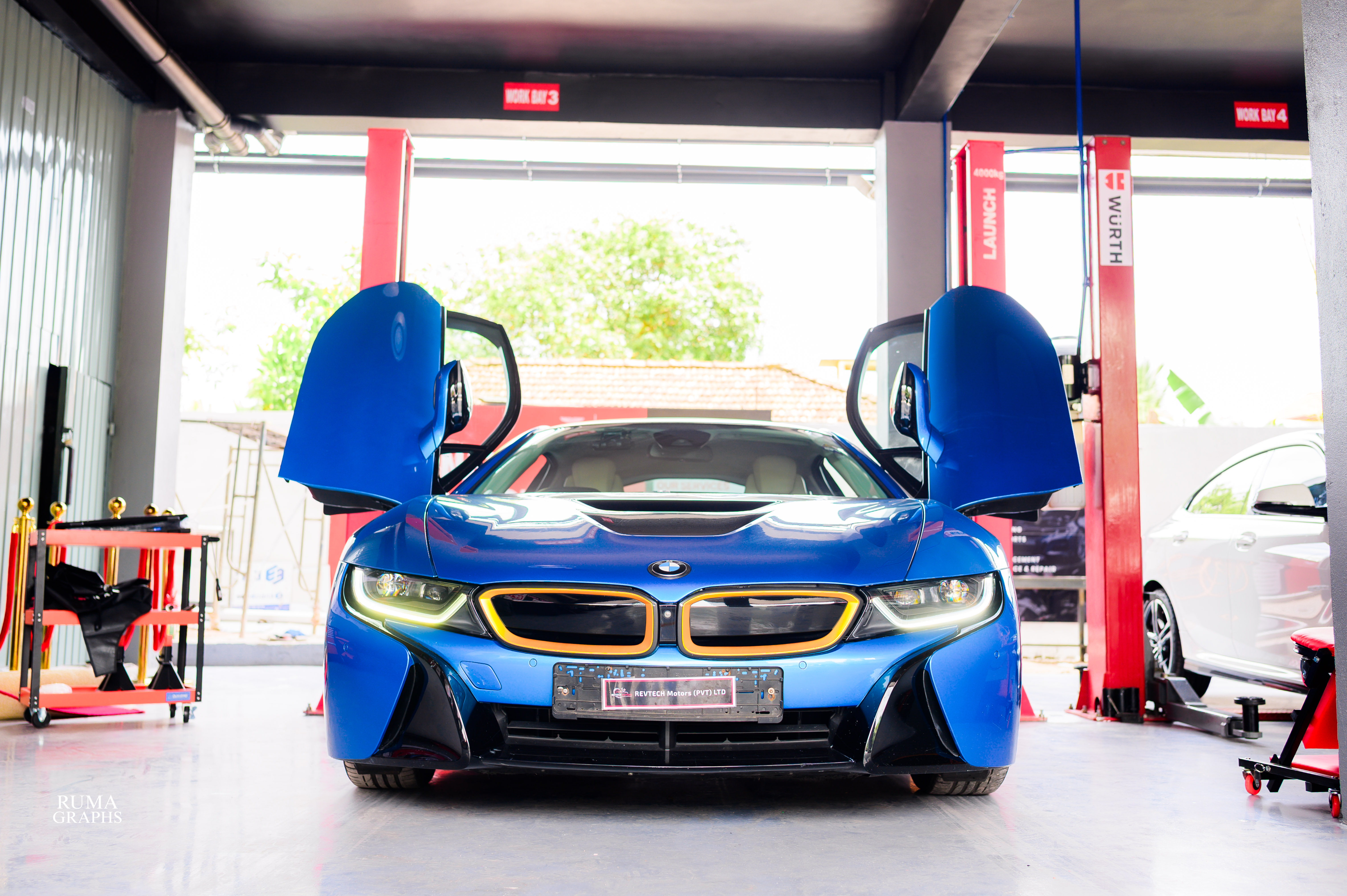 Blue BMW inside the REVTECH Motors workshop