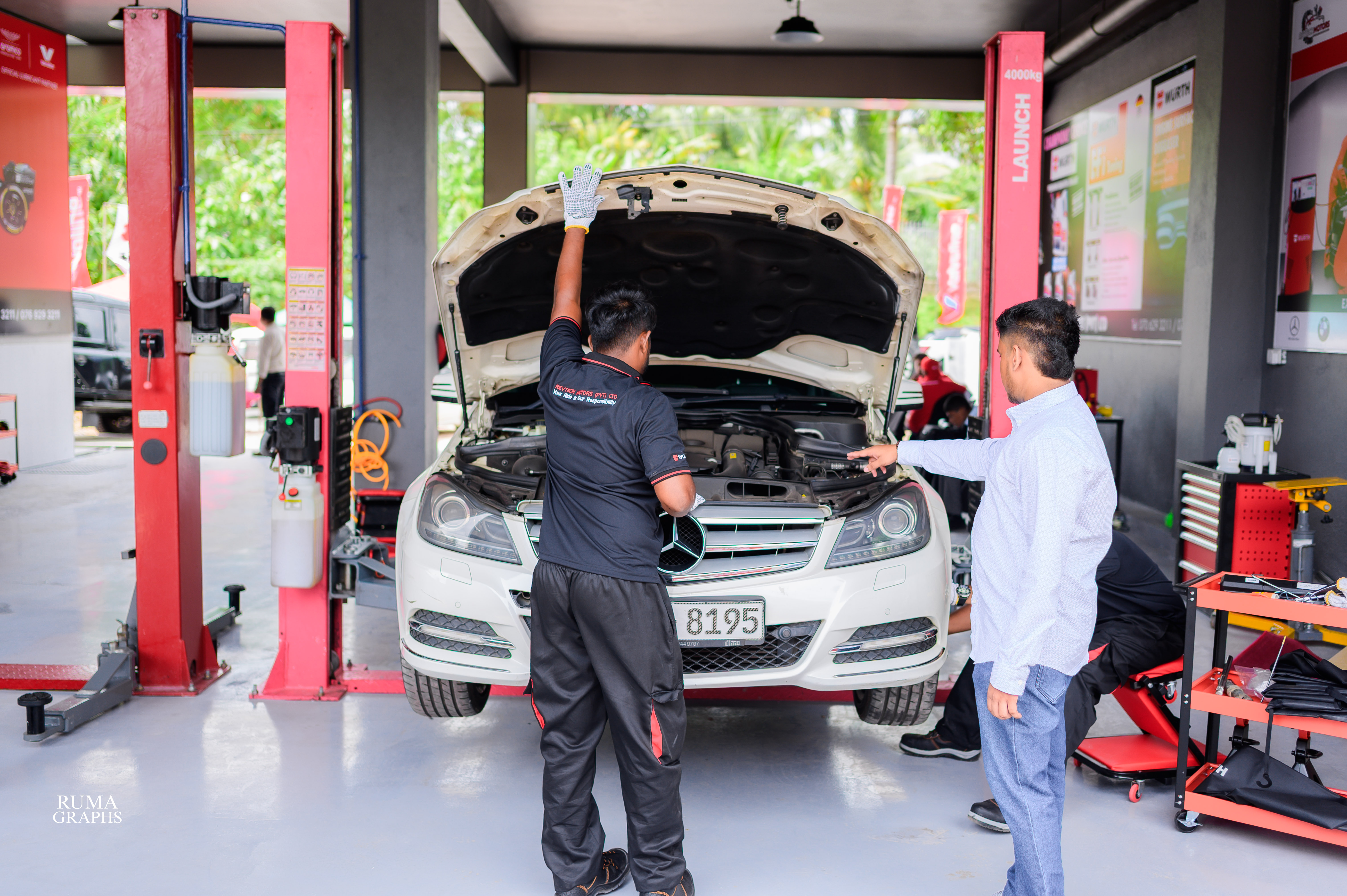 Mechanic working on a vehicle at REVTECH Motors